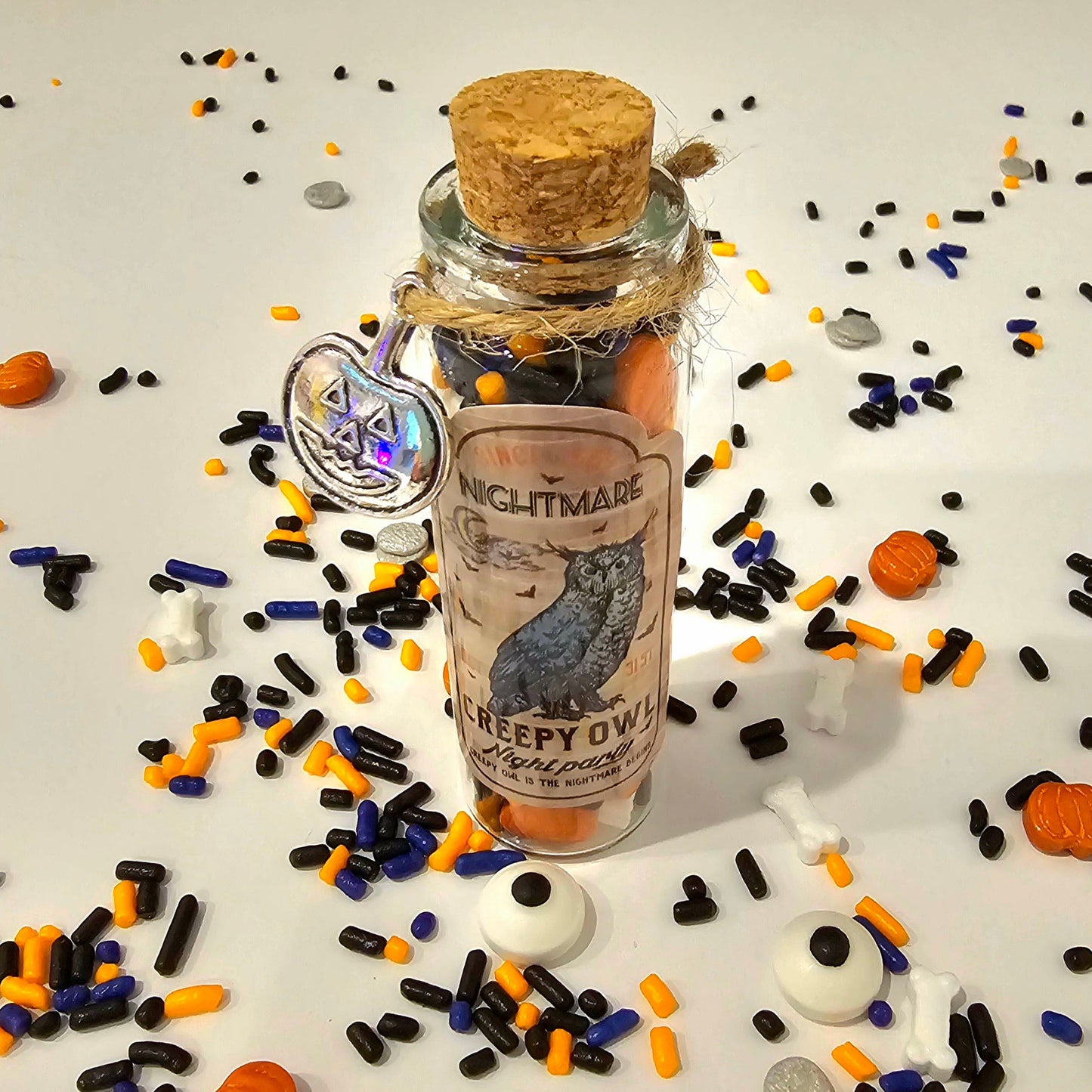 Halloween-themed sprinkle mix in a potion jar at Cake Hoopla's DIY cake-decorating Halloween event in the Portland area.
