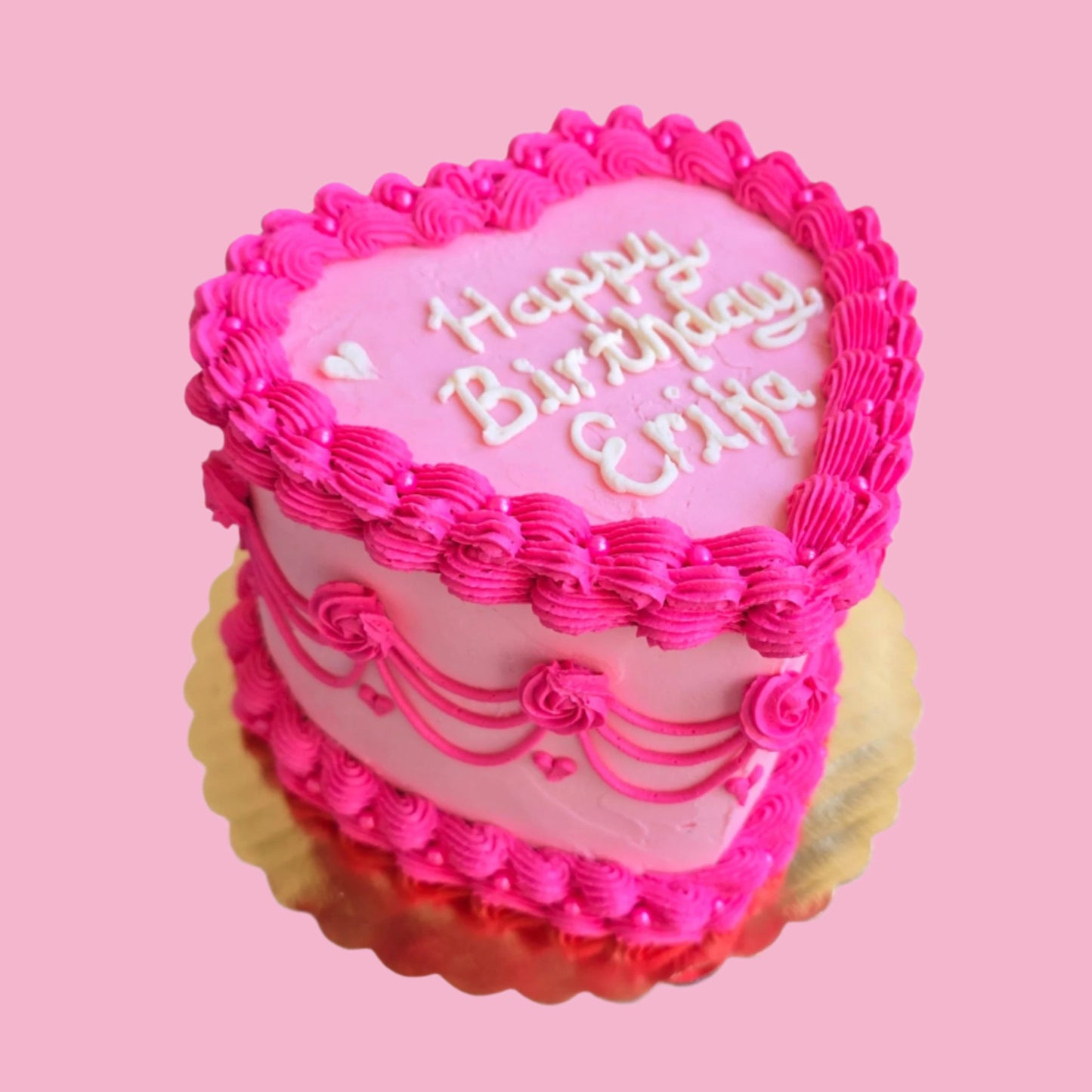 A custom bright pink vintage heart style cake by Cake Hoopla, in Tigard, near Portland, available by preorder.