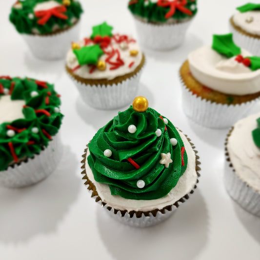 DIY cupcake decorating Christmas cupcake looks like Christmas tree. Green frosting tree with sprinkles as ornaments on top of the cupcake. Available as DIY cupcake-decorating kit at Cake Hoopla in Tigard, near Porltand.