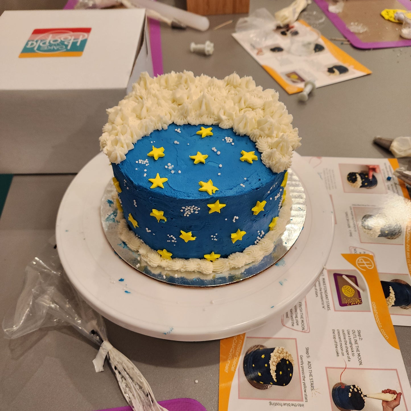 A customer's finished moon cake decorated during a DIY cake-decorating party at Cake Hoopla in Tigard near Portland.