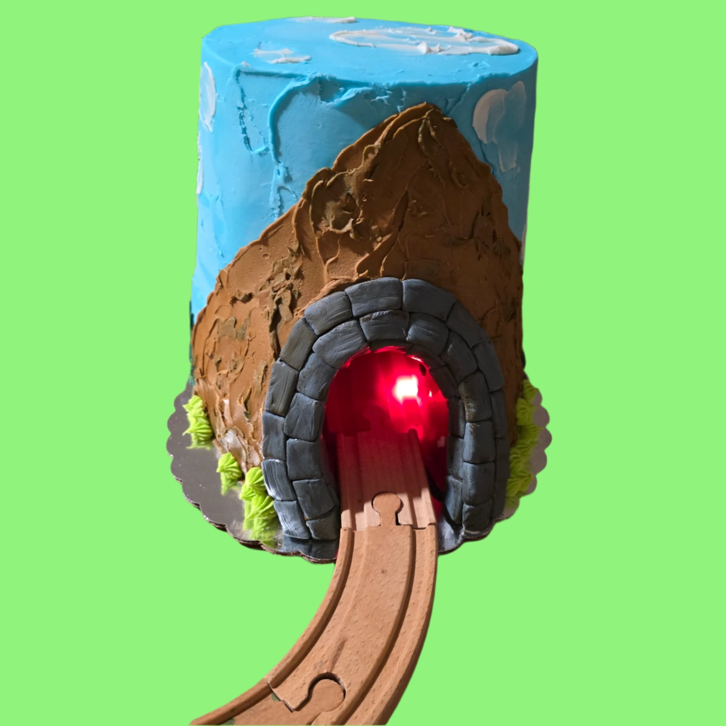 Custom Train Cake by Cake Hoopla, with a real tunnel for an automatic toy train available by preorder from Cake Hoopla in Tigard near Portland.