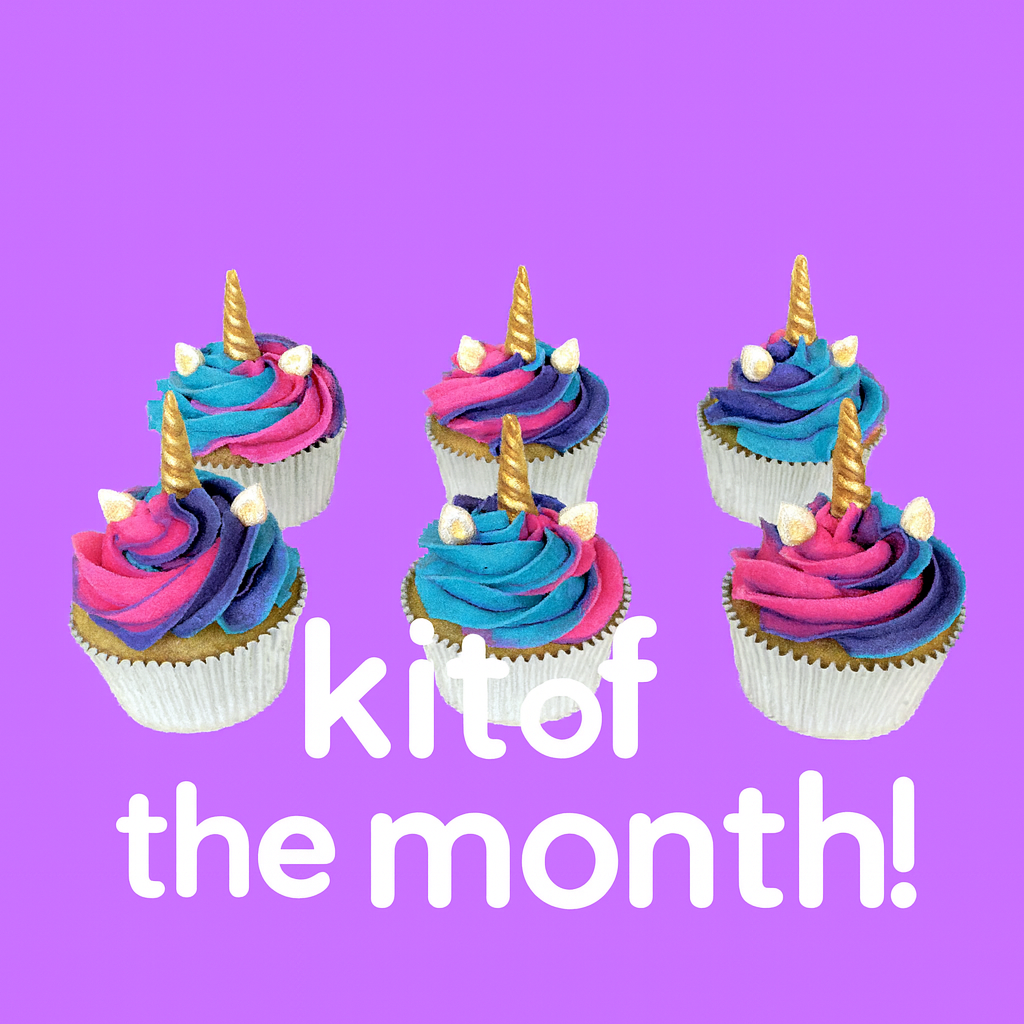 Colorful cupcakes with unicorn horns on a purple background with text 'kit of the month!' available at Cake Hoopla to cupcake club members only, in Tigard, near Portland.