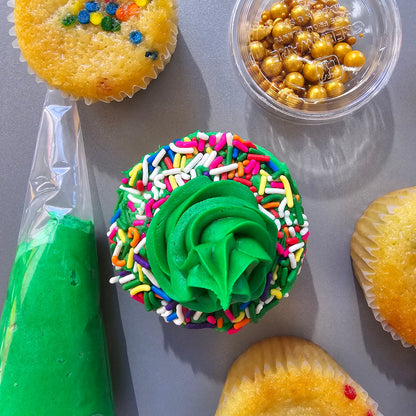 St. Patrick Day themed cupcake kit with white and green frosting, gold and rainbow sprinkles, green fondant, and a shamrock fondant cutter, available at Cake Hoopla in Tigard, Oregon near Portland, during open studio time for DIY cupcake decorating.