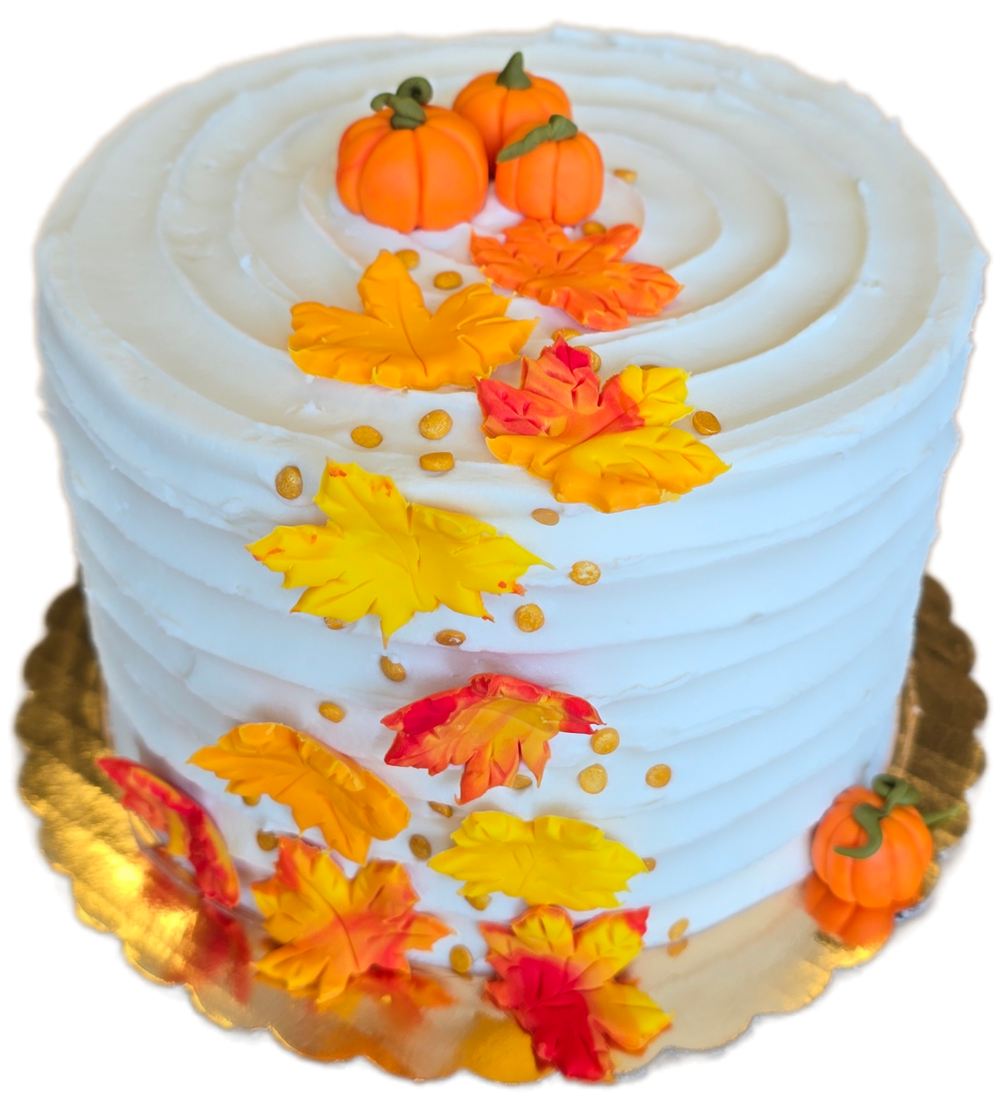 DIY cake by Cake Hoopla in Tigard, near Portland, with autumn-themed decorations including pumpkins and cascading leaves on a white background.