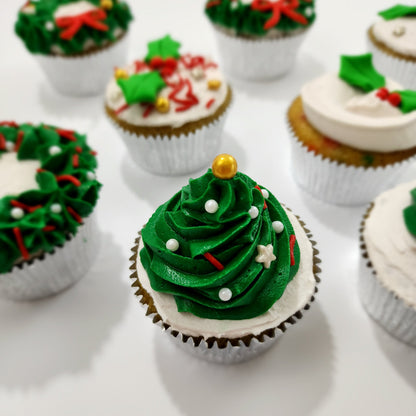 DIY cupcake decorating Christmas cupcake looks like Christmas tree. Green frosting tree with sprinkles as ornaments on top of the cupcake. Available as DIY cupcake-decorating kit at Cake Hoopla in Tigard, near Porltand.