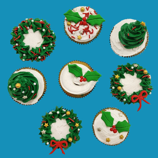 Christmas cupcakes with wreaths, Christmas trees, and holly available to be decorated in a DIY cupcake-decorating kit or ready-to-serve at Cake Hoopla in Tigard, near Portland.