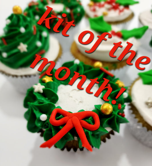 Christmas themed cupcakes with wreaths, holly, and Christmas trees to decorate by Cake Hoopla cupcake club members
