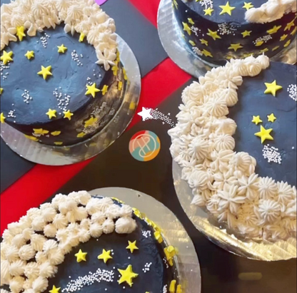 Four finished To the Moon cakes decorated during an adult to-go cake-decorating party in Portland by Cake Hoopla in Tigard, near Portland. 