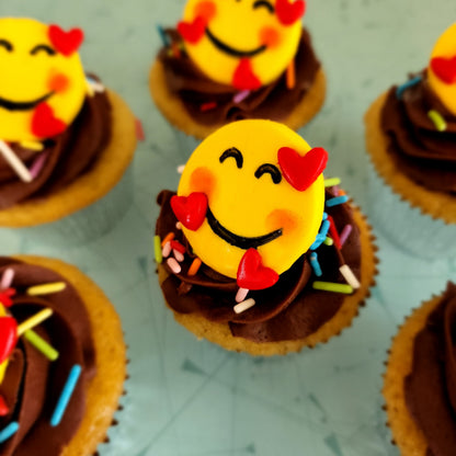 Finished cupcakes from the Happy Hearts Emoji DIY cupcake-decorating kit available for open studio time, as a to-go kit, or ready to serve from the Cake Hoopla in Tigard, Oregon near Portland