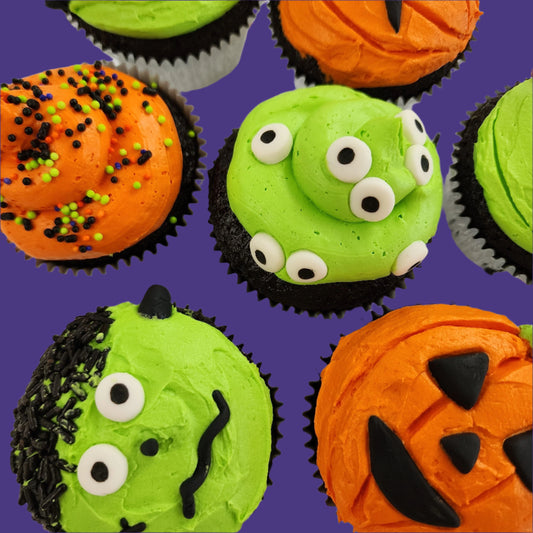 Halloween themed cupcakes with monster blobs, Frankenstein, and Jack O'Lanterns made during  time at Cake Hoopla in Tigard, Oregon near Portland.