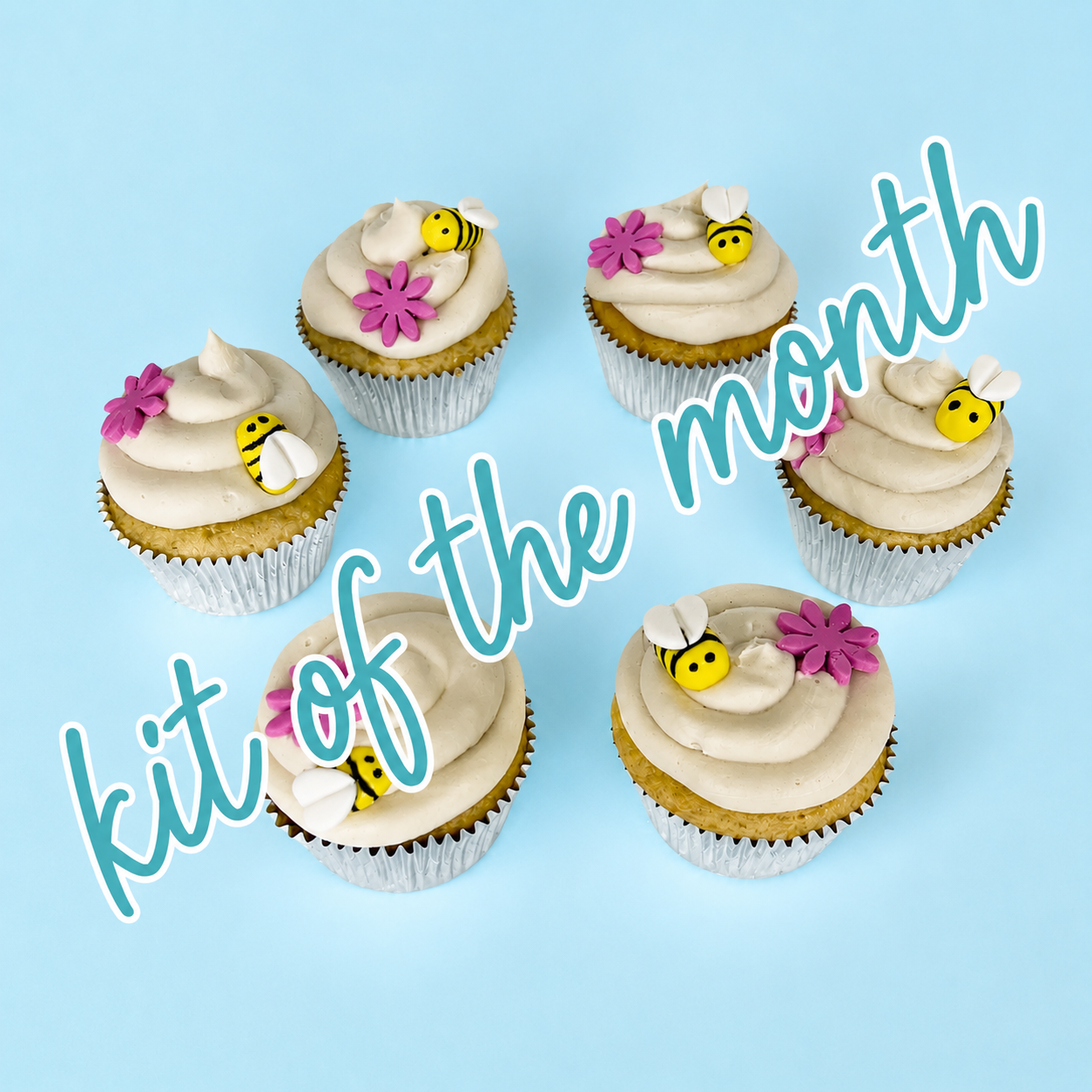 DIY cupcakes with bee and flower decorations on a blue background with text 'kit of the month'.