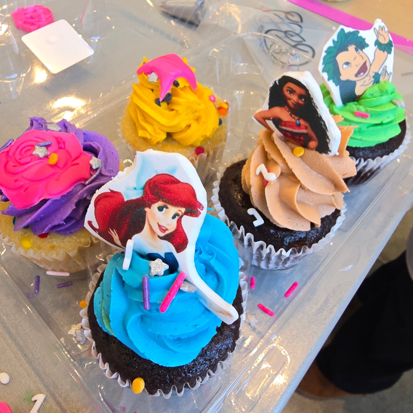 Colorful princess-themed cupcakes by summer cake camper at Cake Hoopla.
