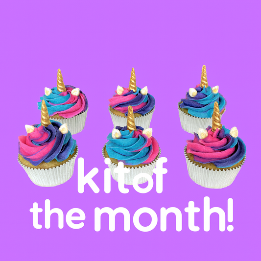 Colorful cupcakes with unicorn horns on a purple background with text 'kit of the month!' available at Cake Hoopla to cupcake club members only, in Tigard, near Portland.