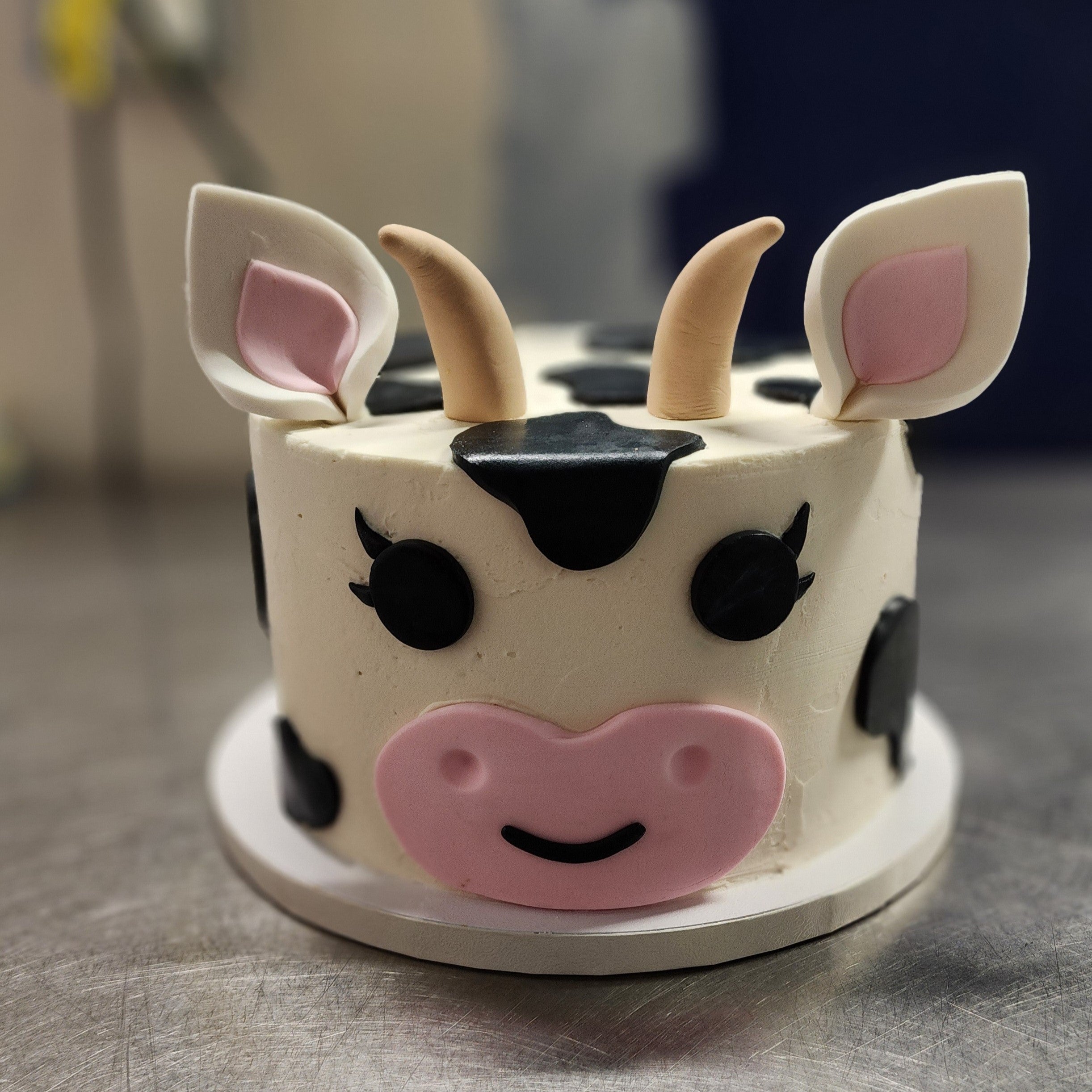 Carved Freesian Cow Cake – The Cake Guru