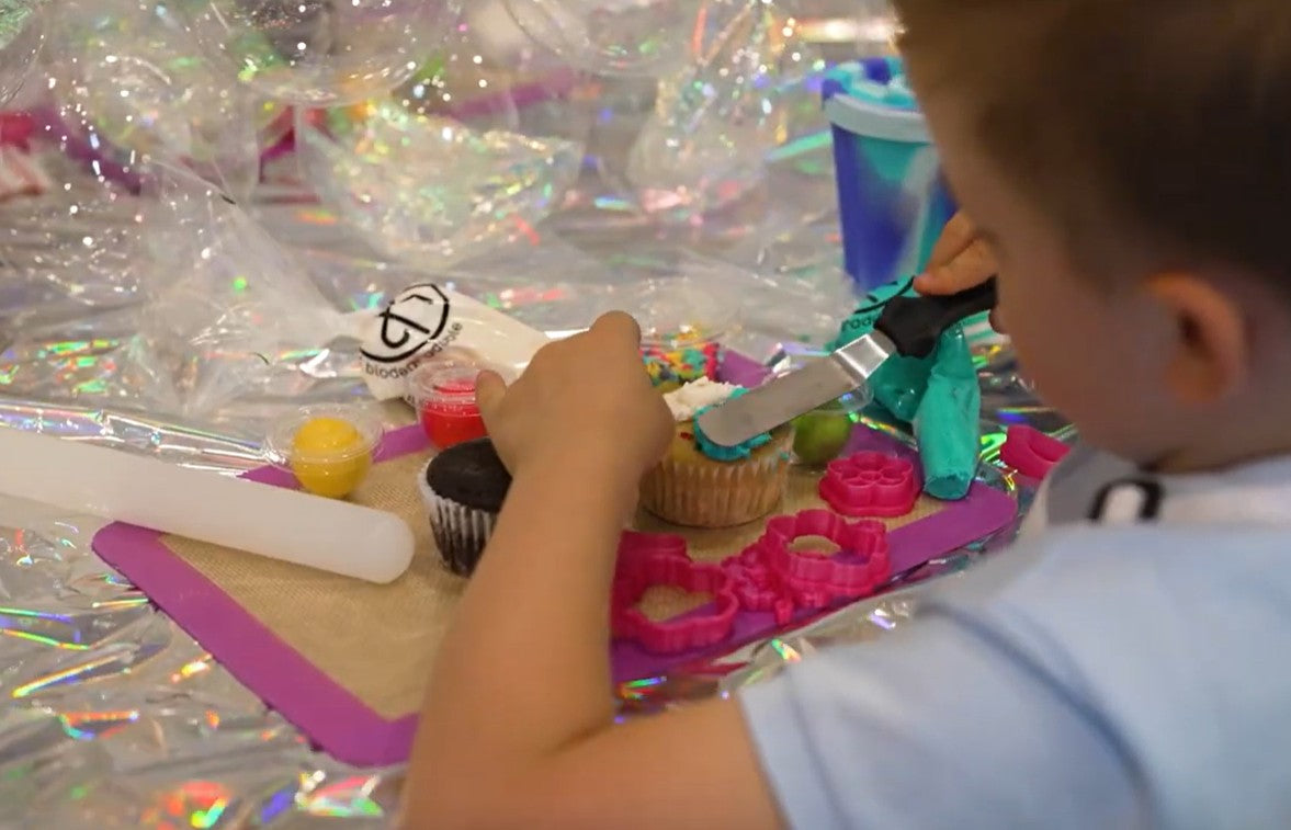 Load video: Kids decorating cupcakes during a DIY cupcake-decorating party at Cake Hoopla in Tigard, near Portland.