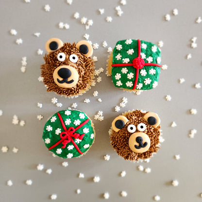 Cupcakes decorated like teddy bears and Christmas presents during a holiday DIY cupcake-decorating class at Cake Hoopla in Tigard, Oregon near Portland.