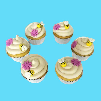 Bee-themed cupcakes with pink flowers available for DIY cake decorating at Cake Hoopla in Tigard, OR near Portland.